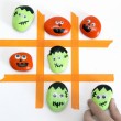 Super Cute Spooky Tic Tac Toe Game using Halloween Painted Rocks! This would be a fun craft to do with kids!